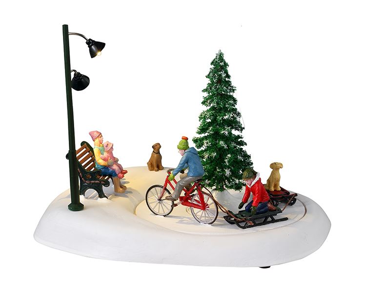 Lemax -'Snowbiking With Dad'- Figuur met animatie - Exclusief adapter (werkt ook op batterijen) afbeelding